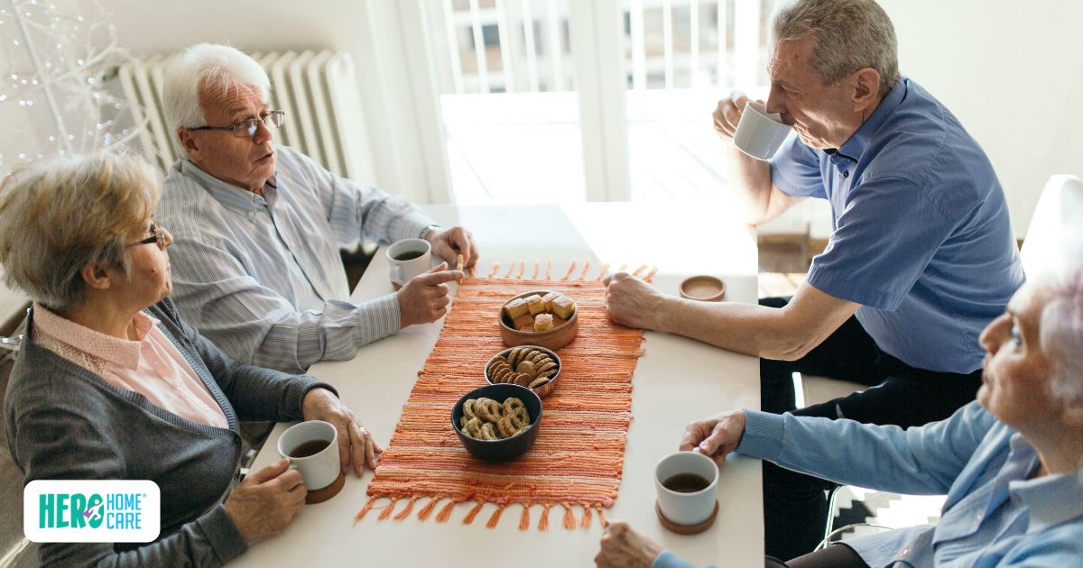 Older adults enjoying a small group meetup, demonstrating the value of socializing with seniors.