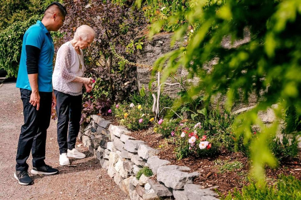Image of Hero Home Care worker on a walk with a client.