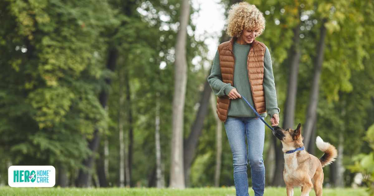 Adult caregiver enjoying a peaceful walk in nature, illustrating how to practice regular self-care and reduce stress.