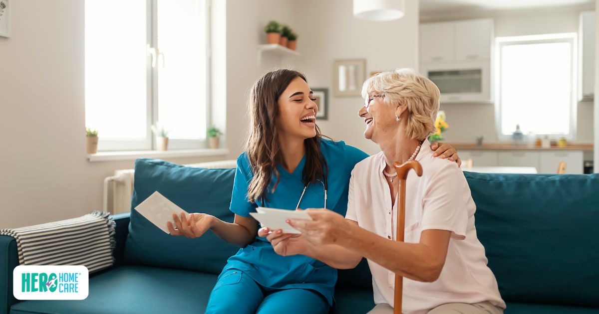 A caregiver sharing a warm conversation with a senior at home, building trust and bonding with seniors as a caregiver.