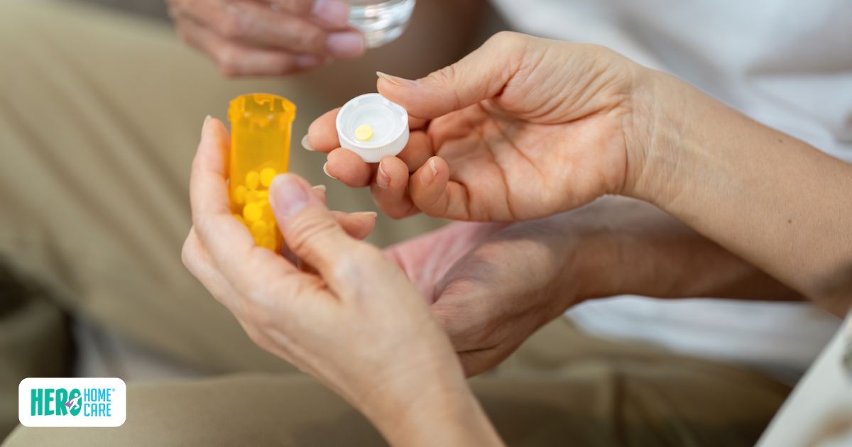 Medication management support provided by a professional caregiver, helping an older adult organize and take prescribed medications safely at home