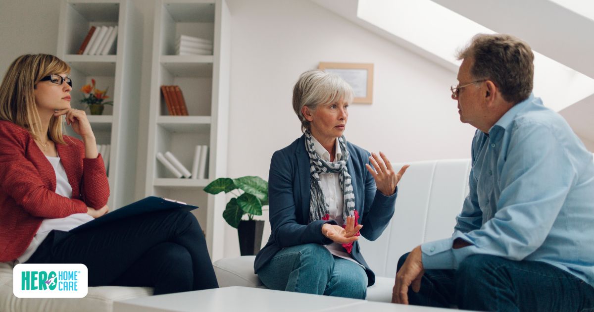 Woman explaining concerns during family discussion about caregiver stress support