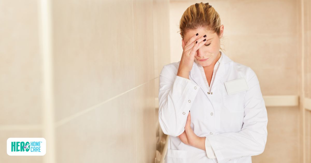 Female caregiver standing alone with a stressed expression, reflecting caregiver guilt and mental exhaustion.