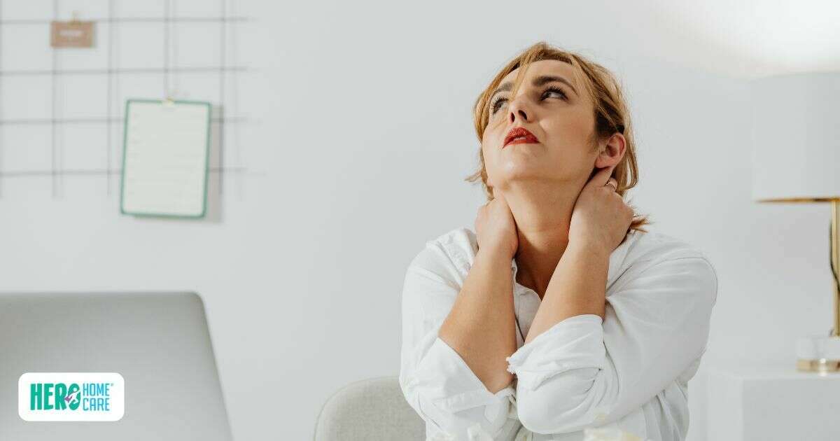 A woman showing visible signs of stress and exhaustion due to family caregiver burnout