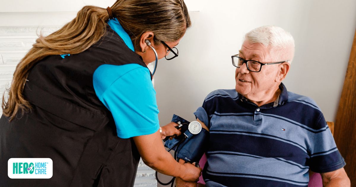 A healthcare professional uses a stethoscope and cuff to check an elderly man's blood pressure, showcasing the essential medical monitoring provided through post surgery home care.