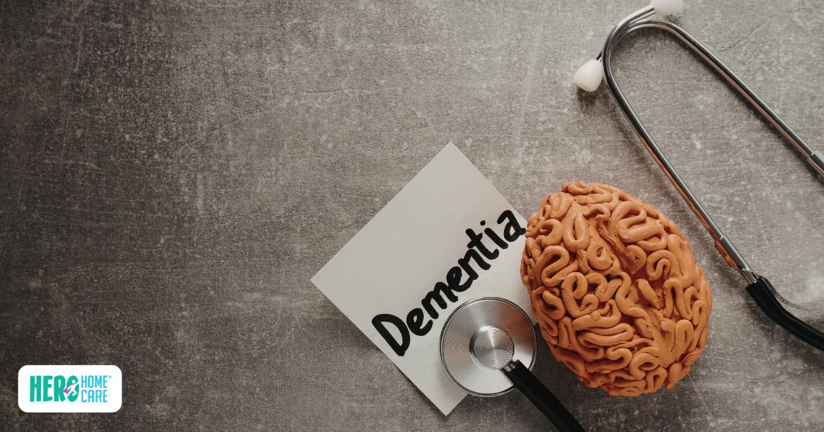 A stethoscope resting on a clay model of a human brain next to a note reading "Dementia," illustrating the focus on the symptoms of dementia.
