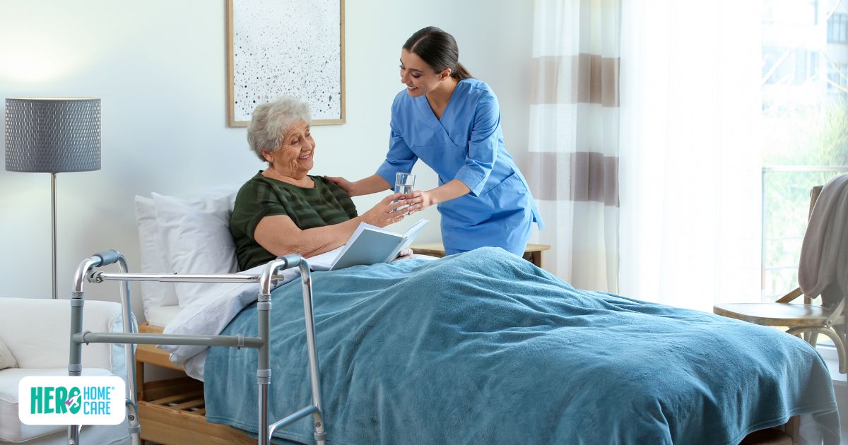 A professional caregiver providing bedside support to an elderly patient in a comfortable home setting, highlighting the emotional and physical benefits of choosing in-home care after hospital discharge.