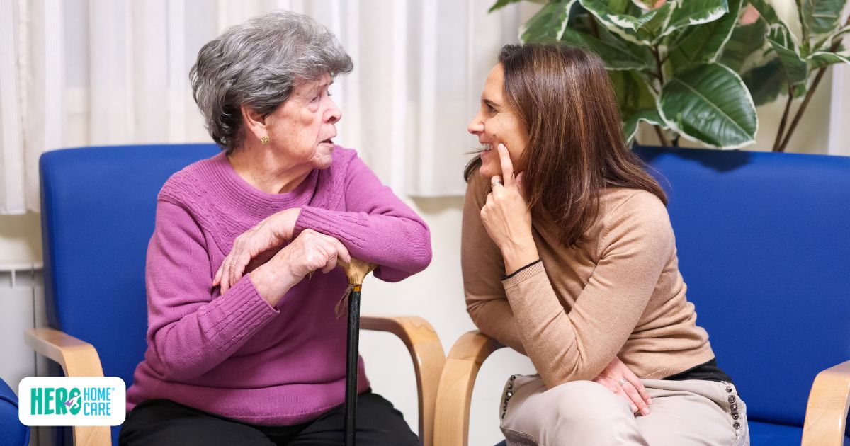 Adult daughter having a respectful conversation with an elderly parent about driving safety and independence