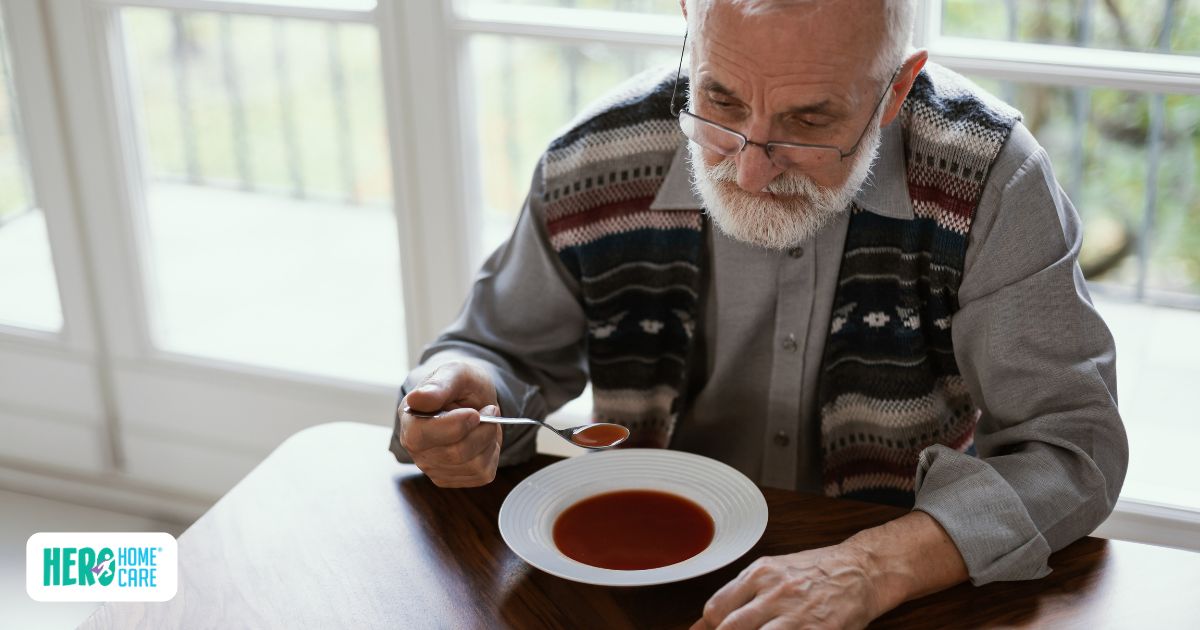 Elderly man eating soup alone, showing isolation and eating challenges for seniors
