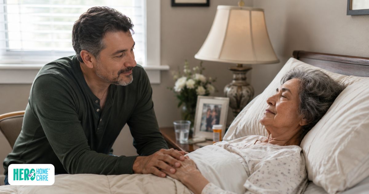 Family member providing comfort and emotional support to a loved one receiving end-of-life care at home in a calm, familiar environment