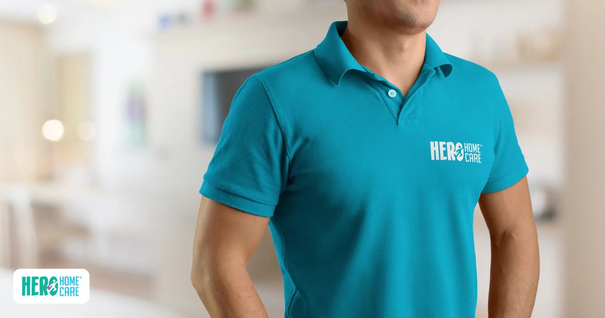Older adult speaking with a home care professional during a home visit, representing personalized dementia care and ongoing assistance
