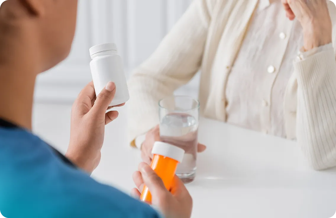 Nurse reviewing a senior's blood sugar readings during a home visit