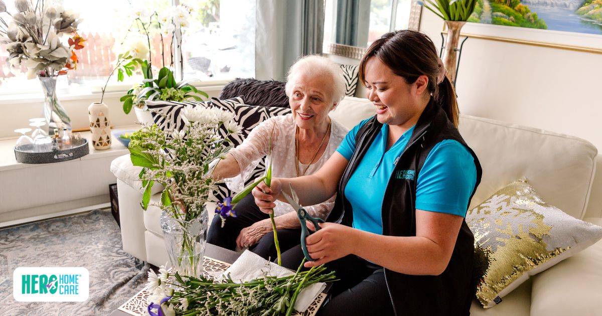 Senior participating in a home-based activity with a care professional as part of home care and aging in place resources in Vancouver.